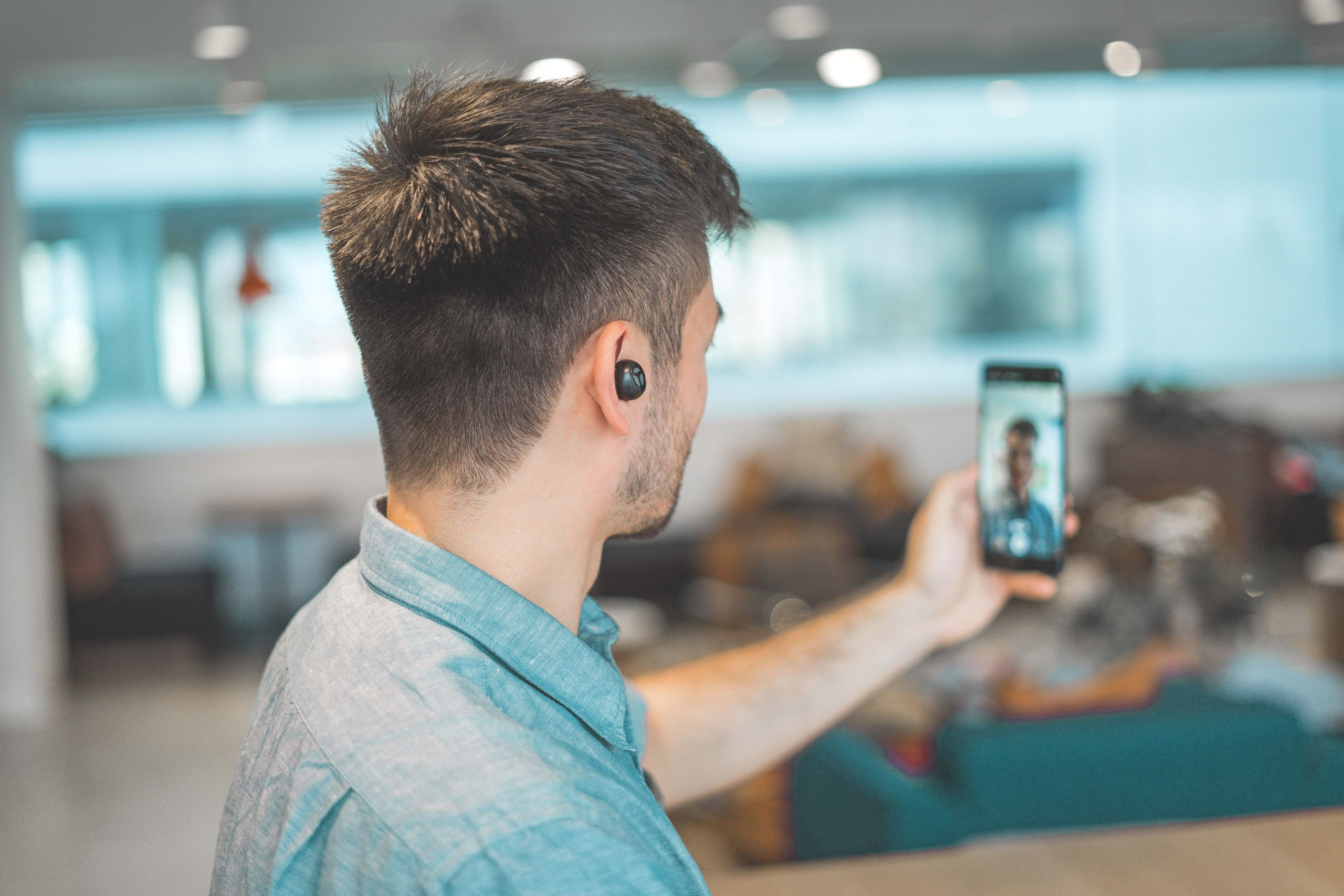 man video calling with his phone